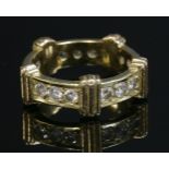 A two-colour gold, diamond set band ring,with a flat section eternity-style ring with sets of