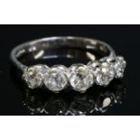 An 18ct white gold graduated five stone diamond ring, with graduated old European cut diamonds,