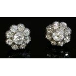 A pair of Victorian diamond cluster earrings, with a later solid basket, post and butterfly