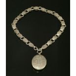 A Victorian silver fancy chain, with tonneau-shaped links with hand engraved decorations, all joined