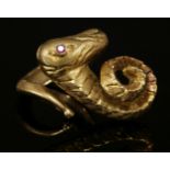 A gold crossover ring,by Ilias Lalaounis, depicting a mythical creature with a large coiled horn and