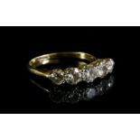 A graduated five stone diamond ring,with five old brilliant cut diamonds, double claw set with white