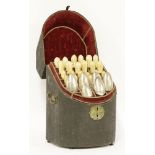 An associated set of twelve knives and twelve forks in associated back fish skin standing box,c.