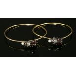 A pair of Victorian garnet, diamond, ruby and pearl set beetle or insect bangles,with hook clasps.