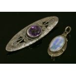 An Arts and Crafts, silver and gold, black opal pendant,attributed to Rhoda Wager, an oval