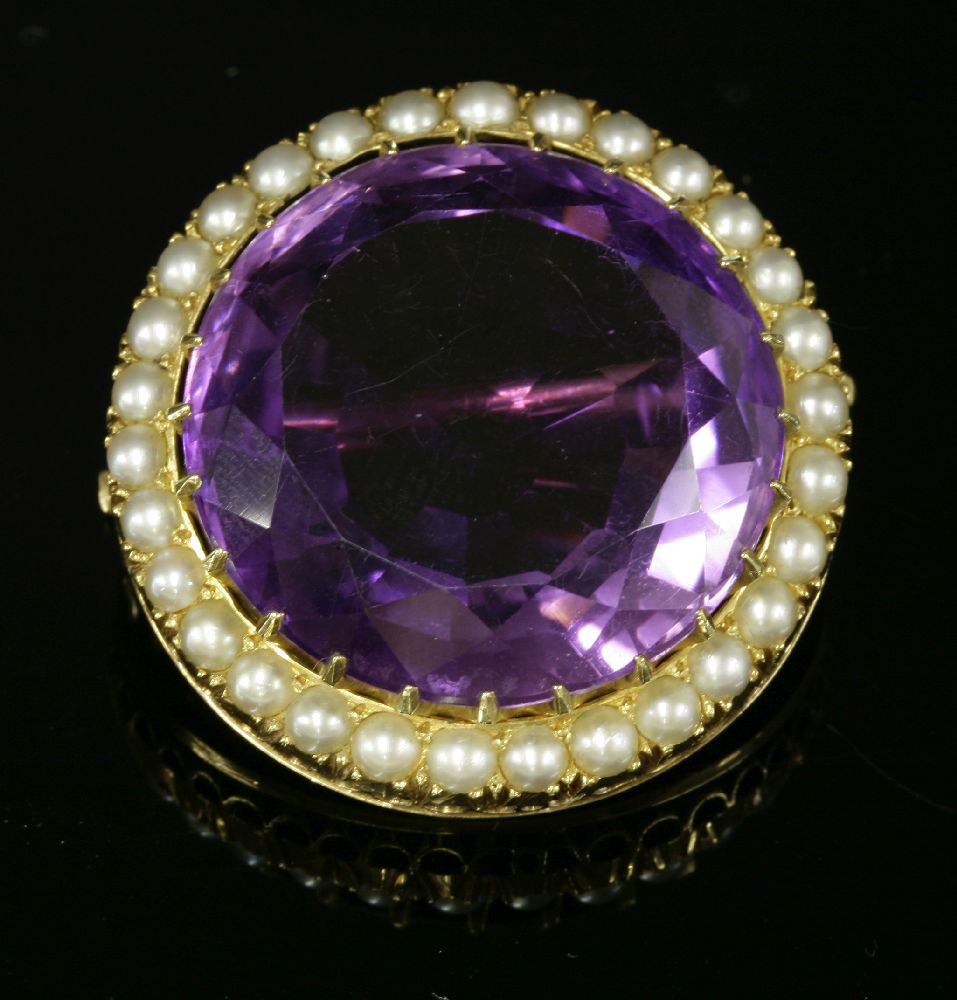 A former Austro-Hungarian Empire amethyst and split pearl brooch, c.1900. A circular mixed cut