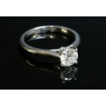 A platinum single stone diamond ring,by Cartier, with a brilliant cut diamond, stated as 0.72ct. The