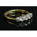 A graduated five stone diamond ring,with five graduated old European cut diamonds, all double claw