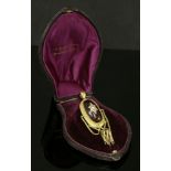 A cased Victorian garnet and diamond swag and tassel pendant, with an oval cabochon garnet centre,