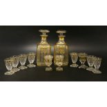 A pair of gilt decorated decanters,20cm high,together with two sizes of glasses,seven,7.8cm high,