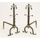 A pair of cast iron andirons,19th century, in the Aesthetic style with stylised flower head