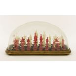 A Chinese ivory chess set, 19th century, the unstained set carved as Western figures, the stained