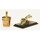 A Victorian desk stand, the sprung top modelled as a cold painted dog,13.5cm long, anda novelty