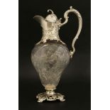 A Victorian silver-mounted cut glass claret jug,William Comyns, London, 1899,the pear-shaped body