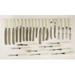 White porcelain-handled cutlery,18th and 19th century, comprising over seventy knives and forks,