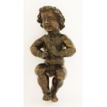 A carved wood figure of a putto,possibly 17th century, lacking wings,43cm high