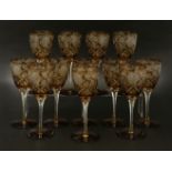 A set of twelve amber cut glass wine glasses,17cm high (12)
