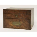 Lewis Carroll's walnut workbox, the hinged lid enclosing a partitioned interior over a base