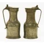 Two pewter tappet hens or flagons,each with hinged flat lid and double acorn thumbpiece,29cm high (