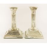 A pair of late Victorian silver column candlesticks,William Naul, Chester, 1900, formed as