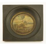 A circular painted tin plaque, 19th century, depicting the ascent of a hot air balloon at