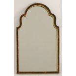 A tortoiseshell mirror,early 20th century, the arched top with gilt moulding, with an easel back,