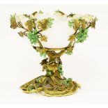 An extraordinary Victorian milk glass bowl,mounted in a bronze stand, in the form of swirling