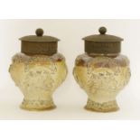 A pair of salt-glazed jars, 19th century, of baluster form with applied details, centred with the