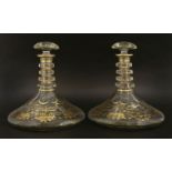 A pair of Bohemian glass ship's decanters,19th century, with four neck rings, with foliate gilt
