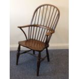 A 19th century oak stick back Windsor Armchair,