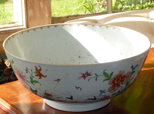 An 18th century Japanese porcelain Bowl hand decorated with cranes amongst flowers etc.