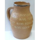 A late 19th century Doulton Lambeth/Slater's Patent stoneware motto Jug with silver rim "He that