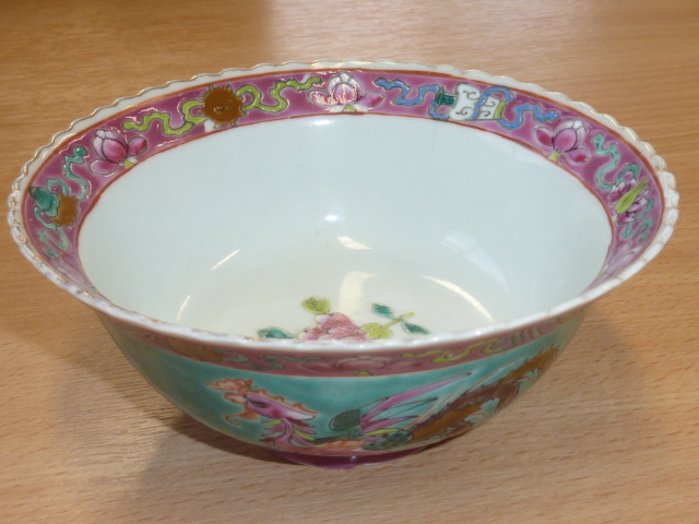 A Chinese porcelain Bowl hand decorated in enamel in the Famille Rose palette in 18th century style