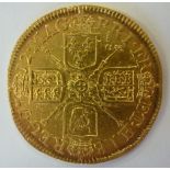 An early 18th century Queen Anne gold Guinea,