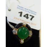 A ladies 18-carat gold designer Ring set with jade, diamonds,