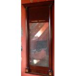 A French Empire period mahogany and gilt metal mounted wall hanging Looking Glass