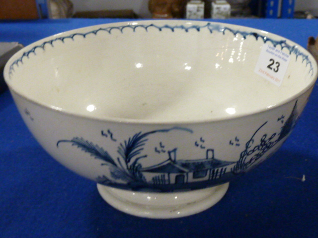 An 18th century Creamware Bowl decorated with buildings and willow trees etc.