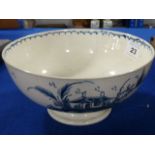 An 18th century Creamware Bowl decorated with buildings and willow trees etc.