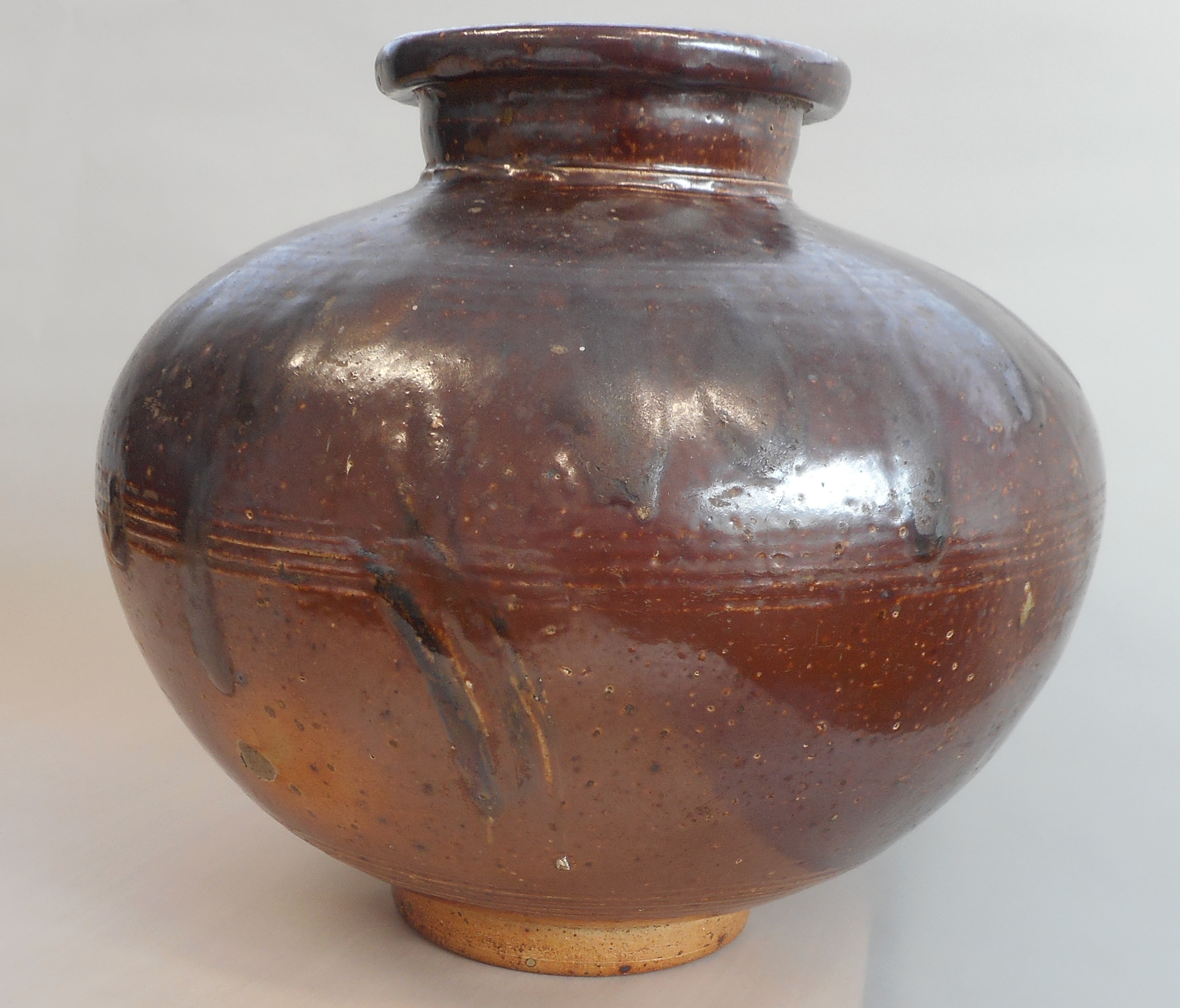 A large 17th century style salt glaze Stoneware Jar of squat ovoid form, outset circular lip,