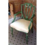 A George III style green painted open Armchair having shield-shaped Hepplewhite style plaque,