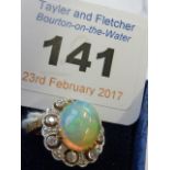 A ladies 18-carat gold large opal and diamond Cluster Ring CONDITION REPORT: Ring