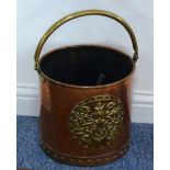 A late 19th/early 20th century hand planished circular copper Coal Bucket with brass handle and