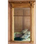 An early 19th century Regency period carved giltwood Pier Glass,