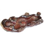 A Chinese carved horn Brush Washer modelled as a lotus leaf with a central frog,