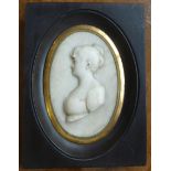 An Italian early 19th century Regency period marble oval Portrait Miniature depicting a female in