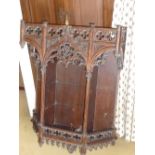 A late 19th century set of wall hanging Shelves highly carved in the French Gothic style with