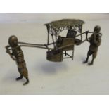 A late 19th/early 20th century Chinese silver Model of a sedan chair and two carriers,