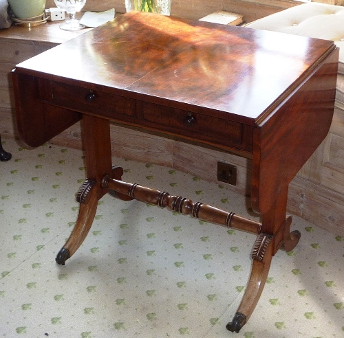 A good and unusual Regency period mahogany Sofa Table of diminutive proportions,