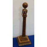 A late 18th century mahogany Wig Stand, fashioned as a tapering column surmounted with a sphere,