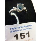 A ladies 14-carat white gold, blue and white diamond Ring,